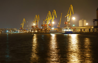 Fototapeta na wymiar Sea port at night. Night view of the commercial sea port of Kaliningrad. 2016.
