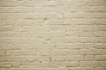 A full page of cream painted brick wall background texture