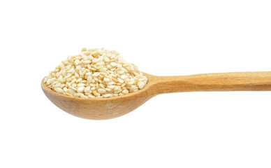 Sesame seeds on wooden spoon isolated on white background