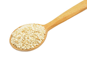Sesame seeds on wooden spoon isolated on white backgroun