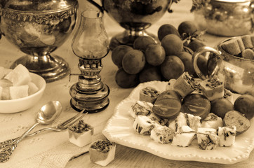 A festive table setting. Image in vintage style. Sepia.