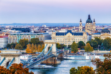 Panorama cityscape of Budapest. View at St Stephen (St Istvan) Basilica and bridge over Danube river with evening traffic in Budapest, Hungary.