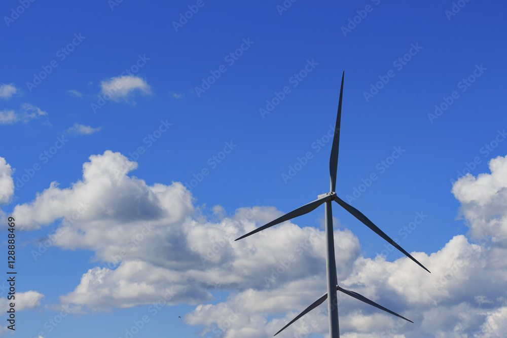 Wall mural wind turbine and white cloud in the blue sky.