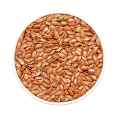 Brown flax seeds isolated on white background