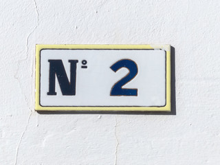 Street sign reading the number two.