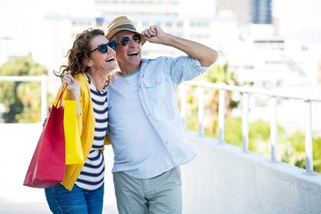 Joyful couple looking away