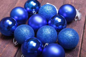 Blue christmas balls on a wooden background