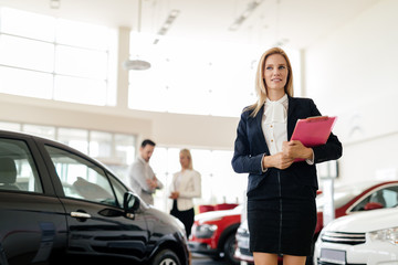 Salesperson workin at car dealership