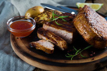 Grilled steak with potatoes and spices