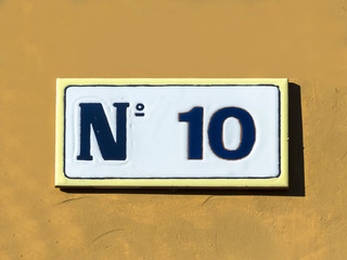Street sign reading the number ten.