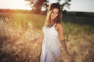 Beautiful carefree woman in fields