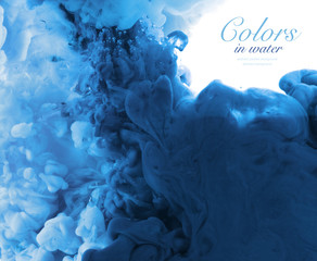 Acrylic colors in water. Abstract background.