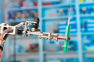 Model of industrial robot manipulator, robot arm with medical syringe
