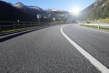 road on the mountain with sunrise