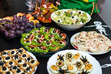 delicious sandwiches and snacks of various kinds on the table