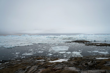 Scenic View Of Icebergs Against Sky