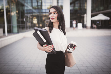 Busy businesswoman outdoors