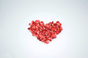 Heart of pomegranate isolated on white background 
