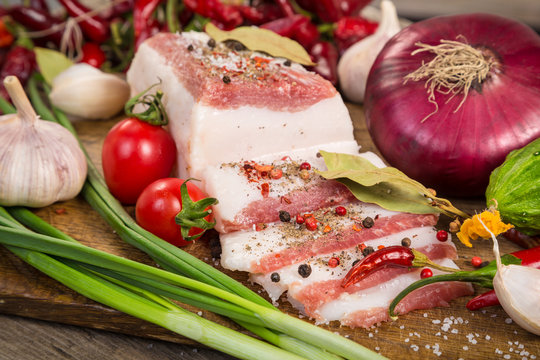 Slices Of Salted Lard With Spices And Vegetables