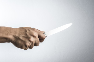 A hand holding knife