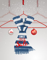 Christmas sale banner with striped knitted scarf on a hanger