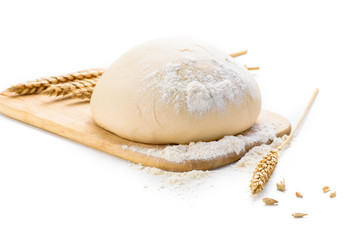 Dough with ears of wheat isolated on white background