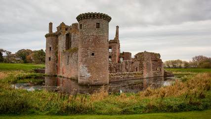 Fototapeta na wymiar Caerlaverock Castle is a moated triangular castle first built in the 13th century. It is located on the southern coast of Scotland, 11 kilometres south of Dumfries