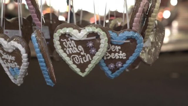 Lebkuchenherz for sale at carnival with 'ich mag dich' written on it.