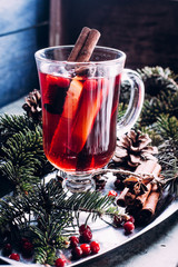 Mulled wine with cowberry, cinnamon, orange and anise. Christmas or New Year drink. Copy space.