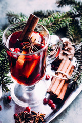 Mulled wine with cowberry, cinnamon, orange and anise. Christmas or New Year drink. Copy space.