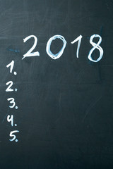 inscription 2018 do it list drawn with chalk on a school blackboard dark