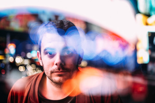 Man looking at camera through glass