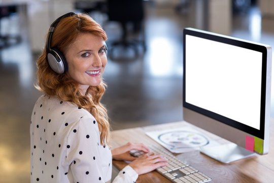 Creative businesswoman working on computer