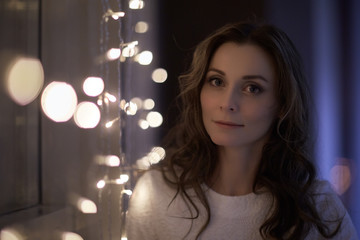 Woman with Christmas light garland