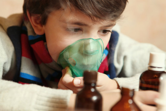 preteen boy with electric inhaler