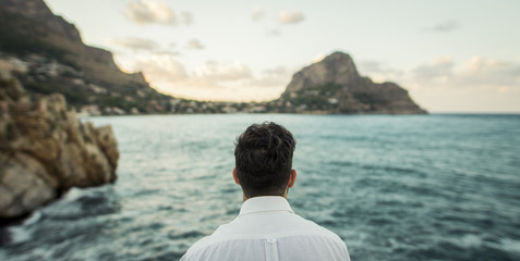 guy in front of the sea