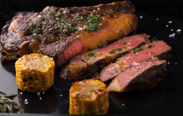 Grilled Black Angus Steak Ribeye  with rosemary and corn