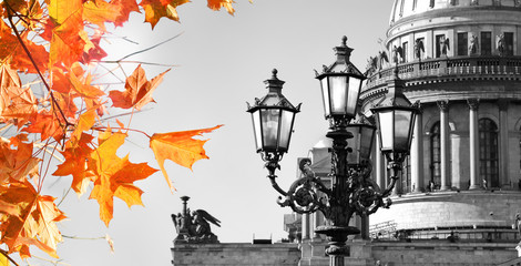 Autumn in St. Petersburg.  Autumn leaves on black and white view of Saint Isaac Cathedral in Saint Petersburg, Russia