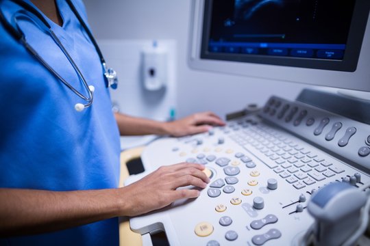 Nurse using ultrasonic device