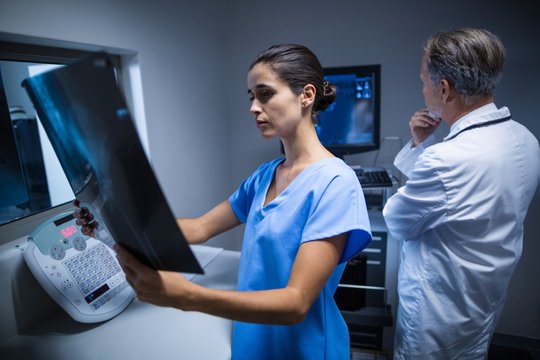 Nurse examining a x-ray
