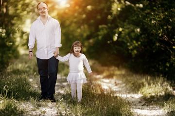 People with down sydrome walking in forest
