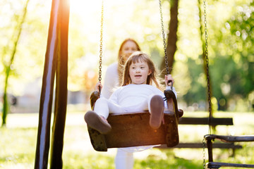 Disabled child enjoying the swing