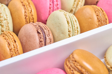 Colorful french macaroons in a box