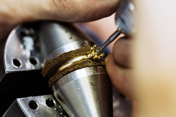 Ring being repaired , crafted by jeweler
