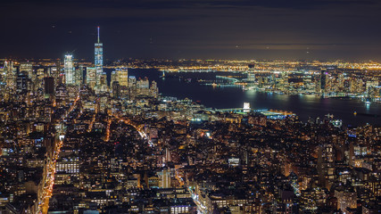 Manhattan aerial panorama cityscape skyline. Far ahead of the Statue of Liberty can be seen. New York City, USA