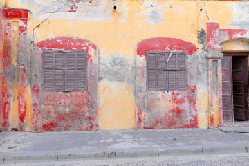 Chipped facade of old colonial house. Saint-Louis-du-Senegal. 2541