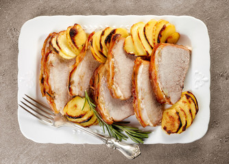 roasted pork slices on white plate