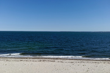 Fototapeta na wymiar Sky, ocean, and beach seascape. Nobody. Horizontal.