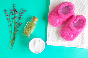 baby accessories with lavender for the bathroom on green background