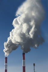 Thick smoke from factory chimneys. Pipe with smoke. Heat energy